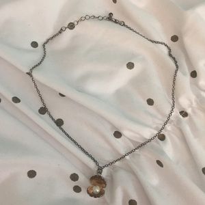 Pearl in shell necklace